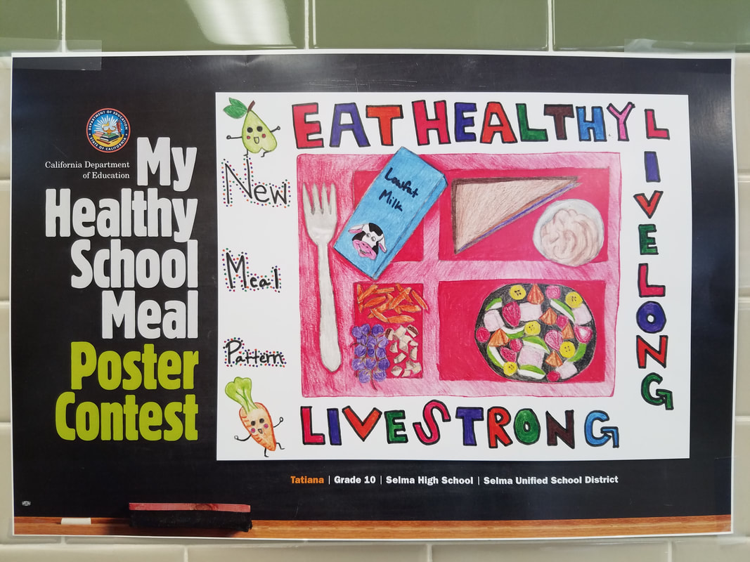 Picture of a studnet designed poster that says to Eat Healthy!