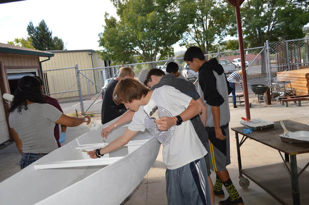 Students boat-building as a team