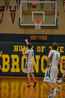Picture of Geyserville player shooting the ball to the hoop